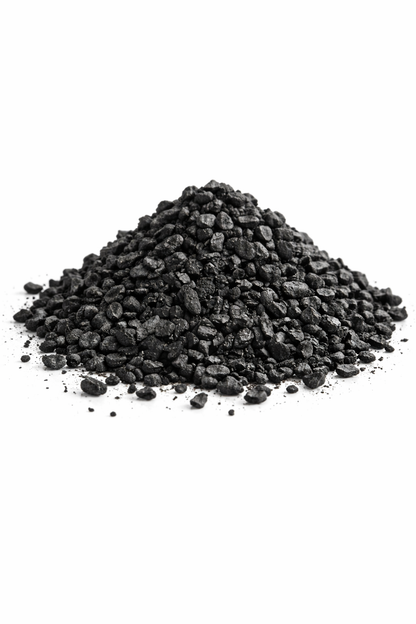Pile of black granular carbonon a white background